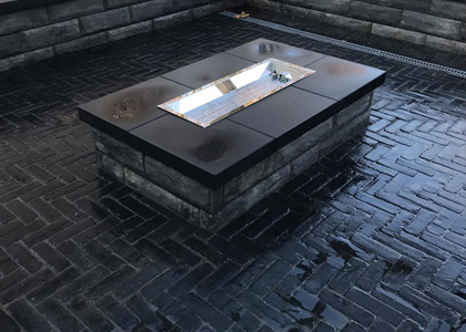 interlock & natural stone surrounding fireplace